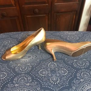 Gold Nine West open toe pumps.